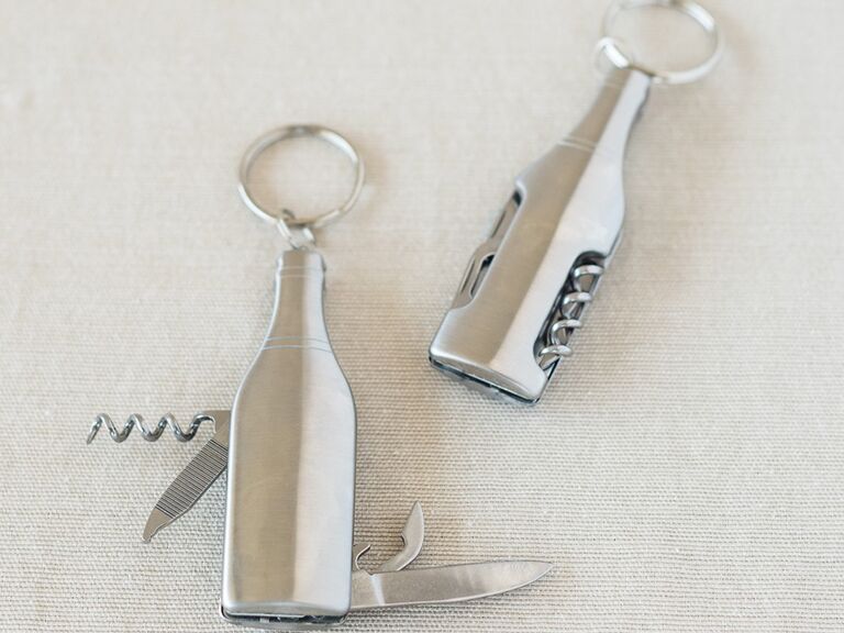 Silver key chain, corkscrew bottle opener and blades