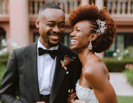 Bride and groom laughing with each other