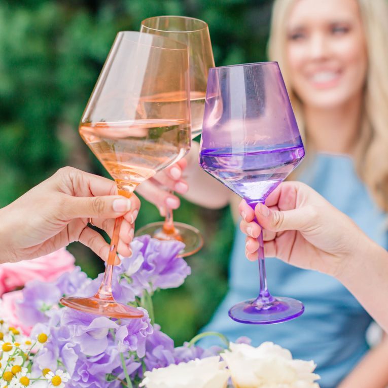 Couple toasting colored glassware martini glasses cool wedding gift idea