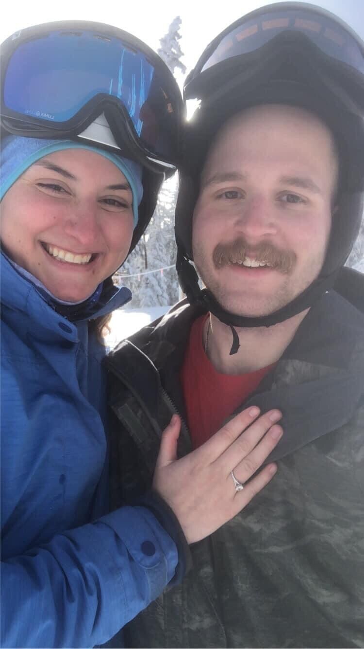 After taking the picture, Sean got as close to one knee as someone can on a pair of skis and popped the question. Michaela asked "is this really happening?" and of course said YES!