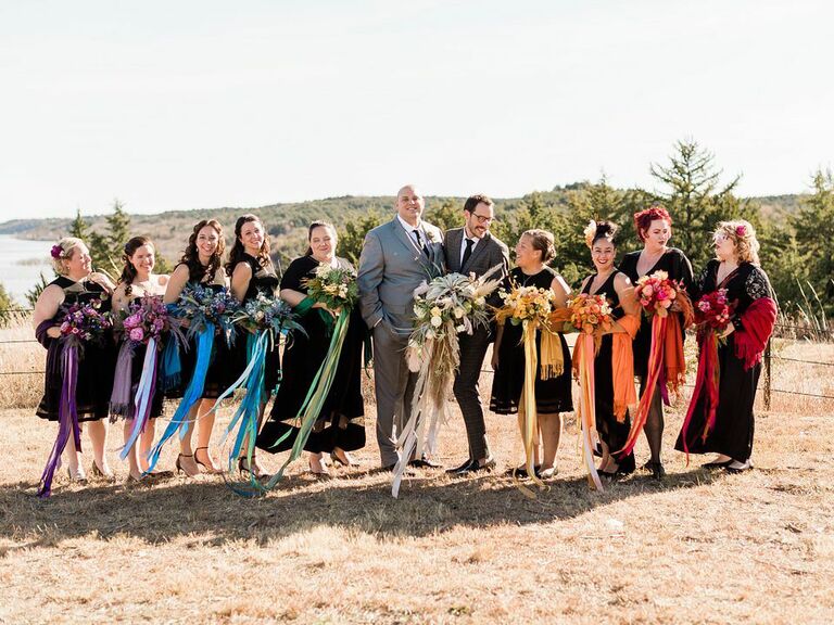Friluftsliv wedding grooms with wedding party and rainbow colored ribbons
