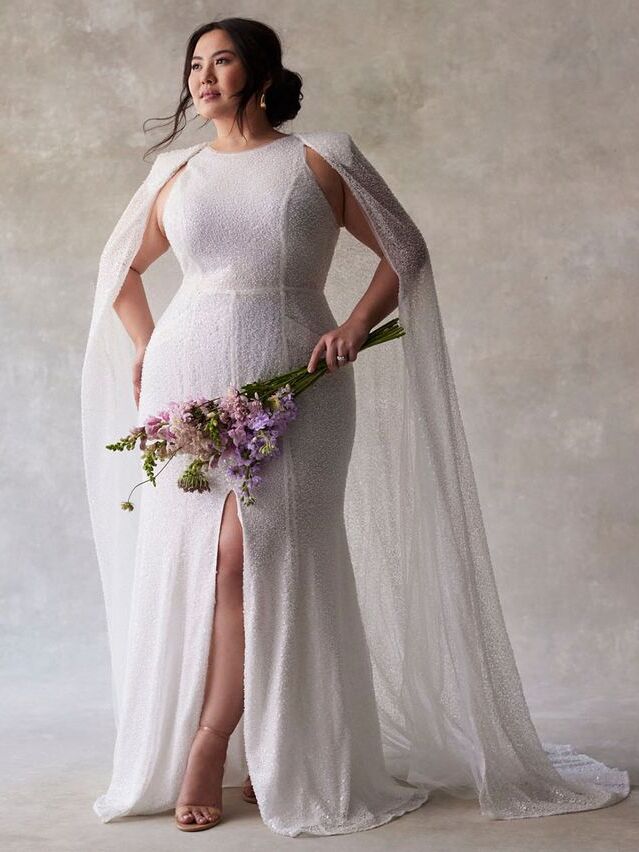 Sparkly wedding dress with cape by ELOQUII. 