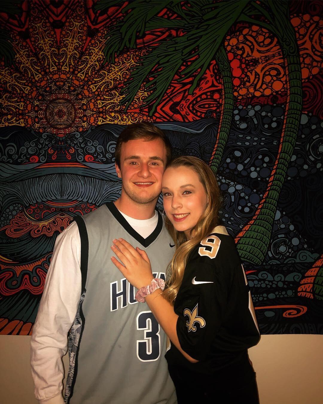 Chris and Emily met on, not one, but two dating apps. The first time they swiped right on each other was December of 2018. The second time they matched was exactly (to the date) one month later on a different app, but this time Emily had to make the first move! She sent "howdy" and the rest was history. This is a photo of Chris and Emily's first fraternity date function before they had officially started dating. 