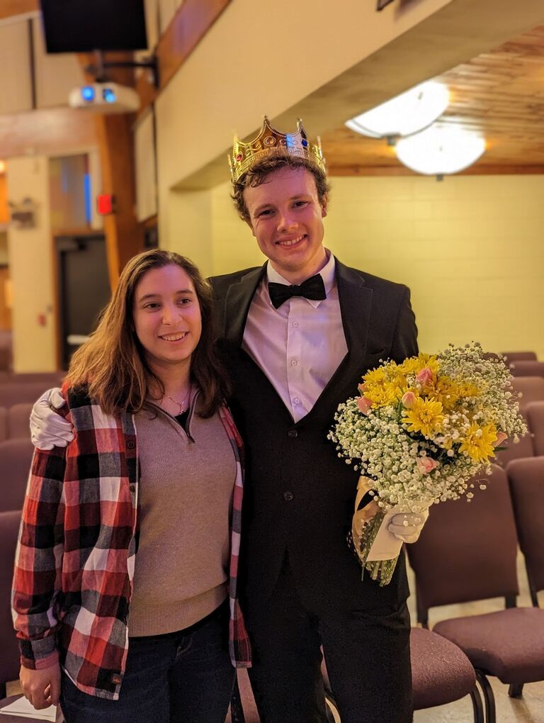 Kyle winning the Mr. Cairn competition (male pageant show) that Ash persuaded him to do.