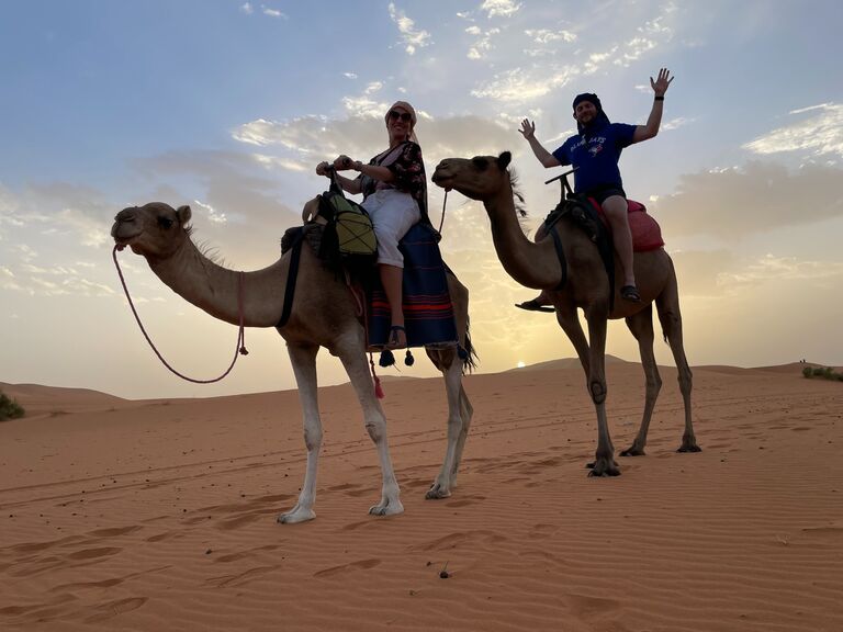 Riding camels through the Sahara Desert in Morocco.