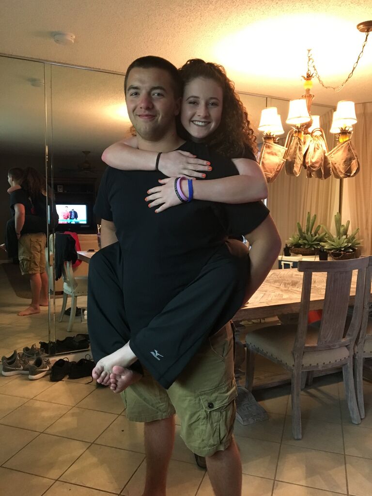 Their parents became great friends, as did Nick and Caitlin, and their families took a vacation together to Florida together back in 2017 - before they were dating!