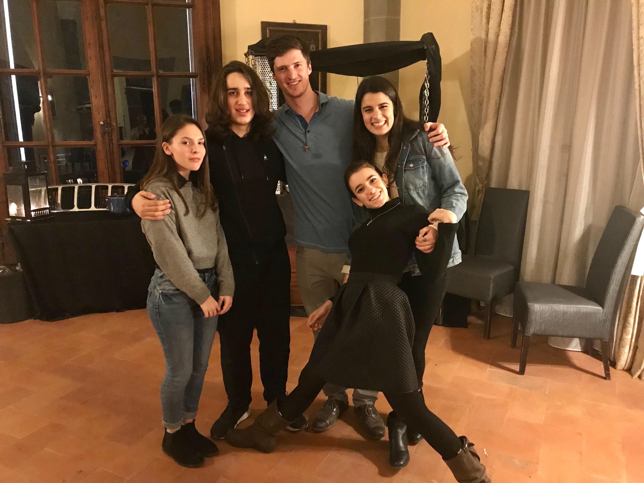 Peter and Sarah got paired up for an exchange program in Florence called "English for Pasta". They spent every Tuesday having dinner with three amazing families (kids pictured here). On the two mile walk to the dinner, Sarah and Peter got to know each other. At the end of the semester, they admitted that they "liked" each other. Sarah remembers first realizing she had feelings for Peter after a 23 mile trek across Florence, capped by a pizza dinner and trip to a local jazz club. Peter's feelings dated back well before that.