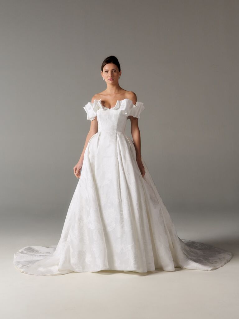 Ruffled off-the-shoulder ball gown wedding dress by Poeza