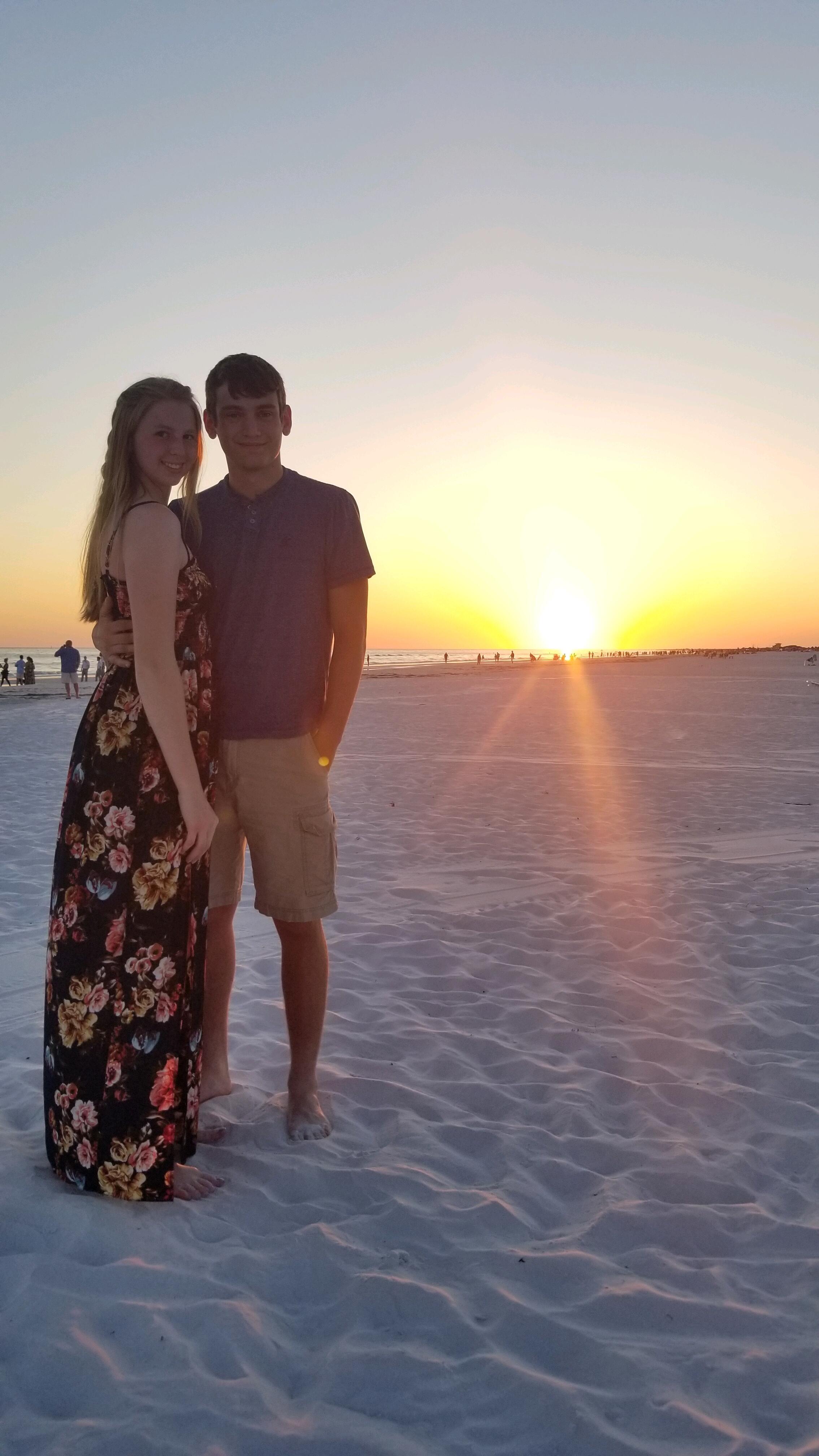 Roger, Kelly, and Kelly's Parents all went to Siesta Key for the most beautiful beach and sunset! - Kelly also asked Roger to prom, writing it out in the sand.