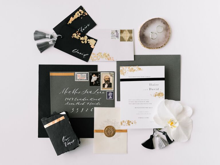 modern new year's wedding invitations with gold leaf details and silver tassels