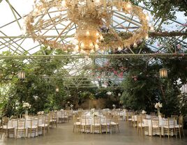 Greenhouse wedding venue with hanging shrubbery