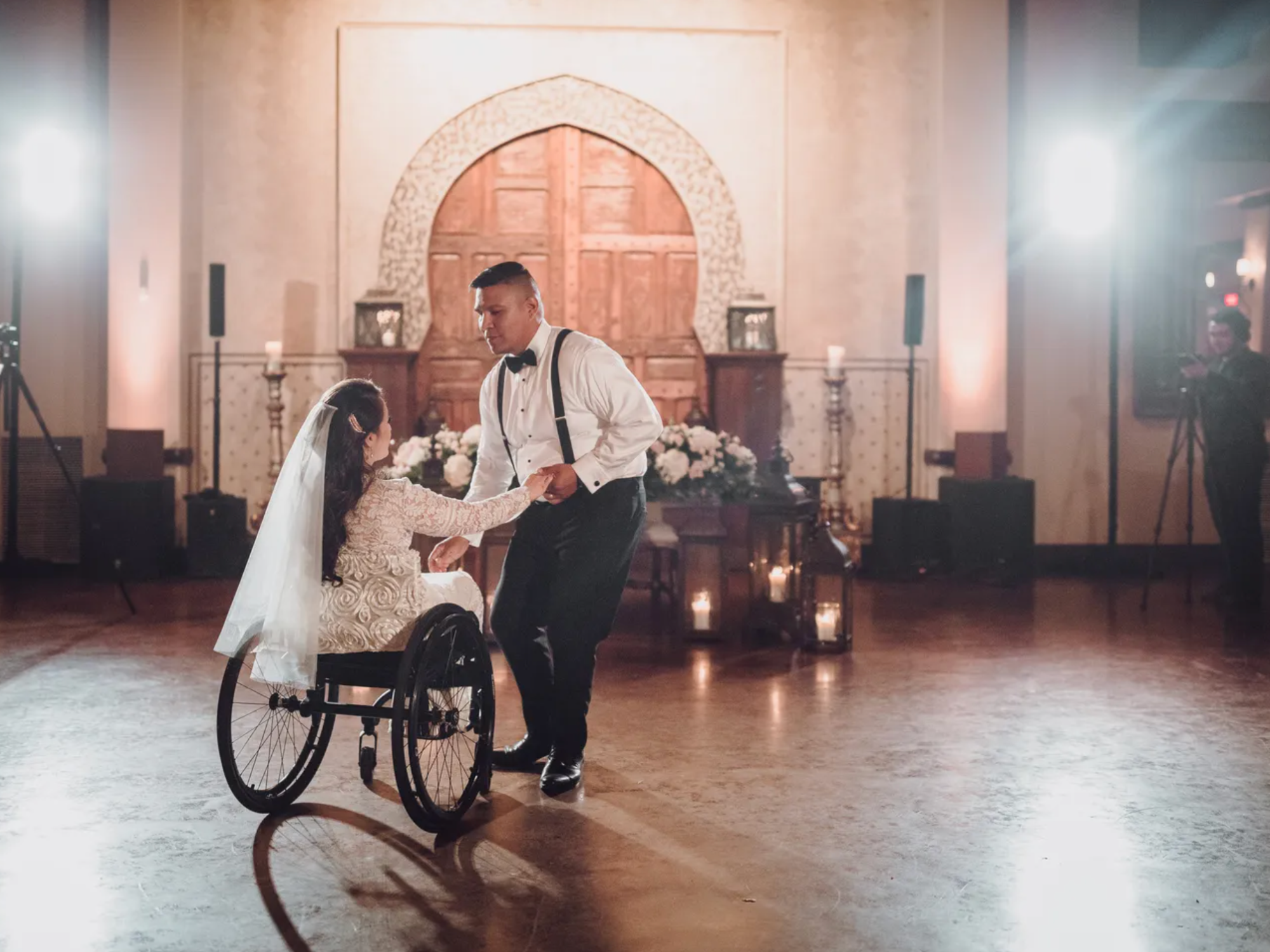 Disabled couple dancing on dancefloor at handicap-accessible wedding venue