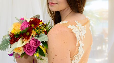 Premium AI Image  A bride with a bouquet and a crown of flowers