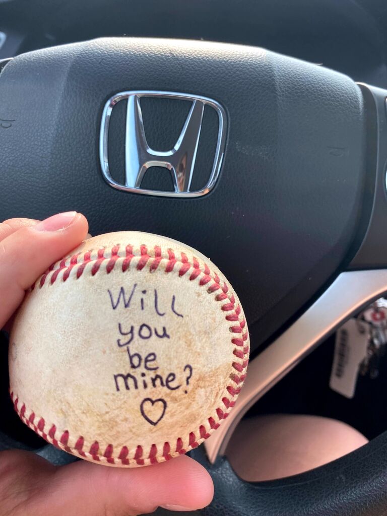 Alyssa helped Tyler get the gym set up for the new school year. After leaving, he gave her a recent game ball with an important question.