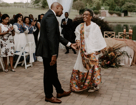 Groom on the dance floor with his mother on the wedding day.