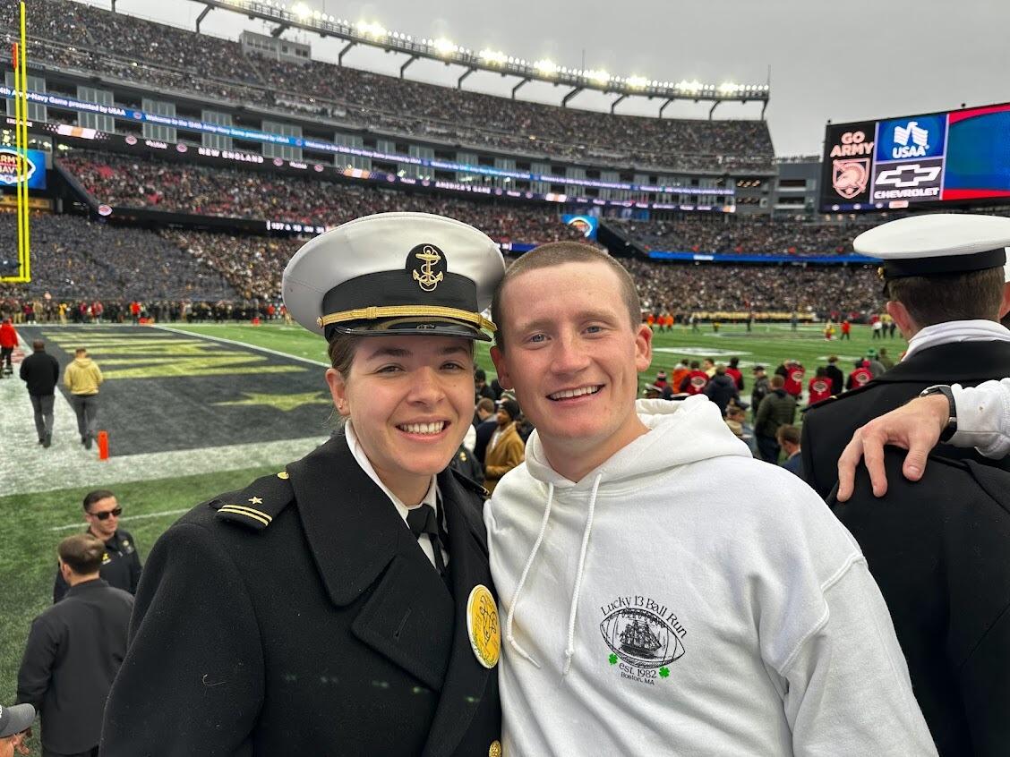 Sara and Andrew at their last Army-Navy game in Boston, MA after Andrew and the 13th Company ran the ball 456 miles from Annapolis to the game!