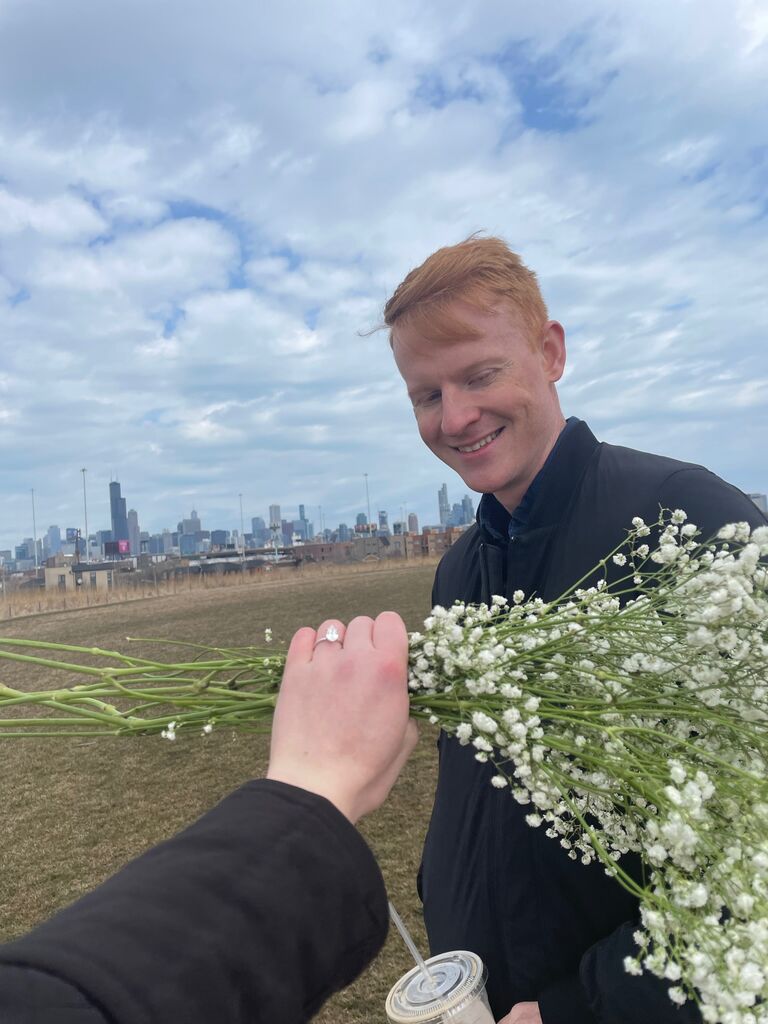 After the proposal, handing out extra flowers to random kind strangers at the park.