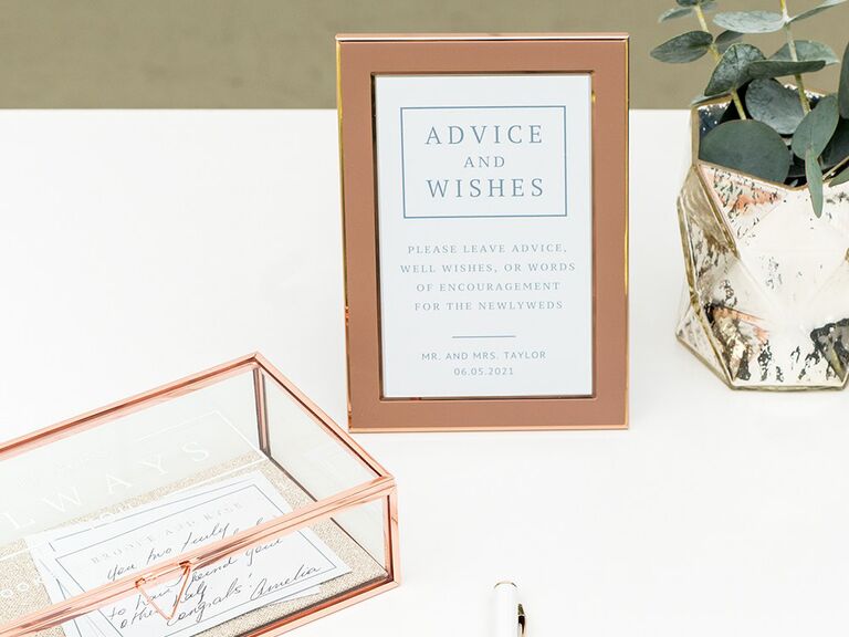 'Advice and wishes' in minimal blue type in bronze frame
