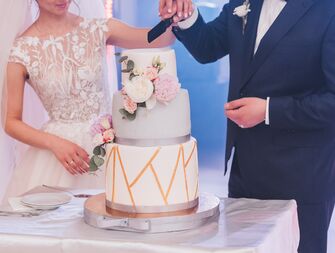 couple cutting wedding cake