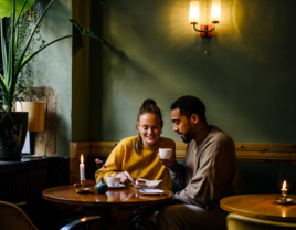 Couple on date having coffee in cafe