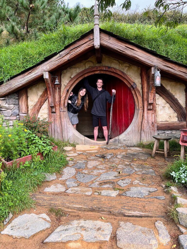 Mike's goal for New Zealand was to visit the Lord of the Ring shooting locations,  Kristy went house hunting for a home that fit her size. (Hobbiton in New Zealand)