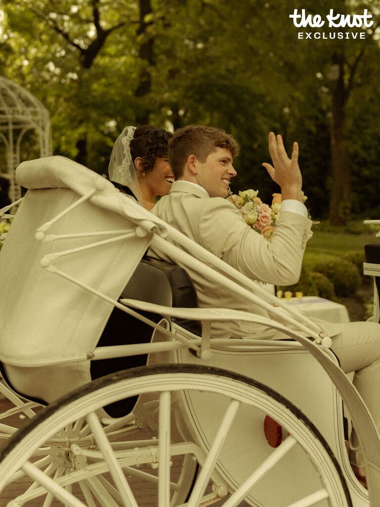 Tommy Winkler and Jessica Pappas riding a horse-drawn carriage through their wedding venue