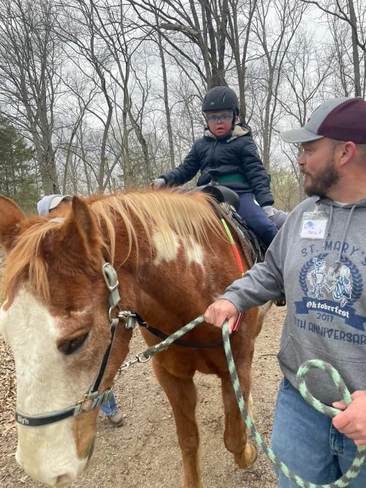Neil and Cheyenne loved volunteering at Helping Hands and Horses where they help individuals with disabilities