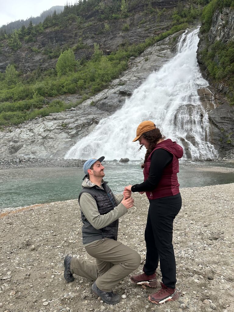 She says "Yes!" at nugget falls in front of the Mendenhall Glacier in Juneau Alaska. 
