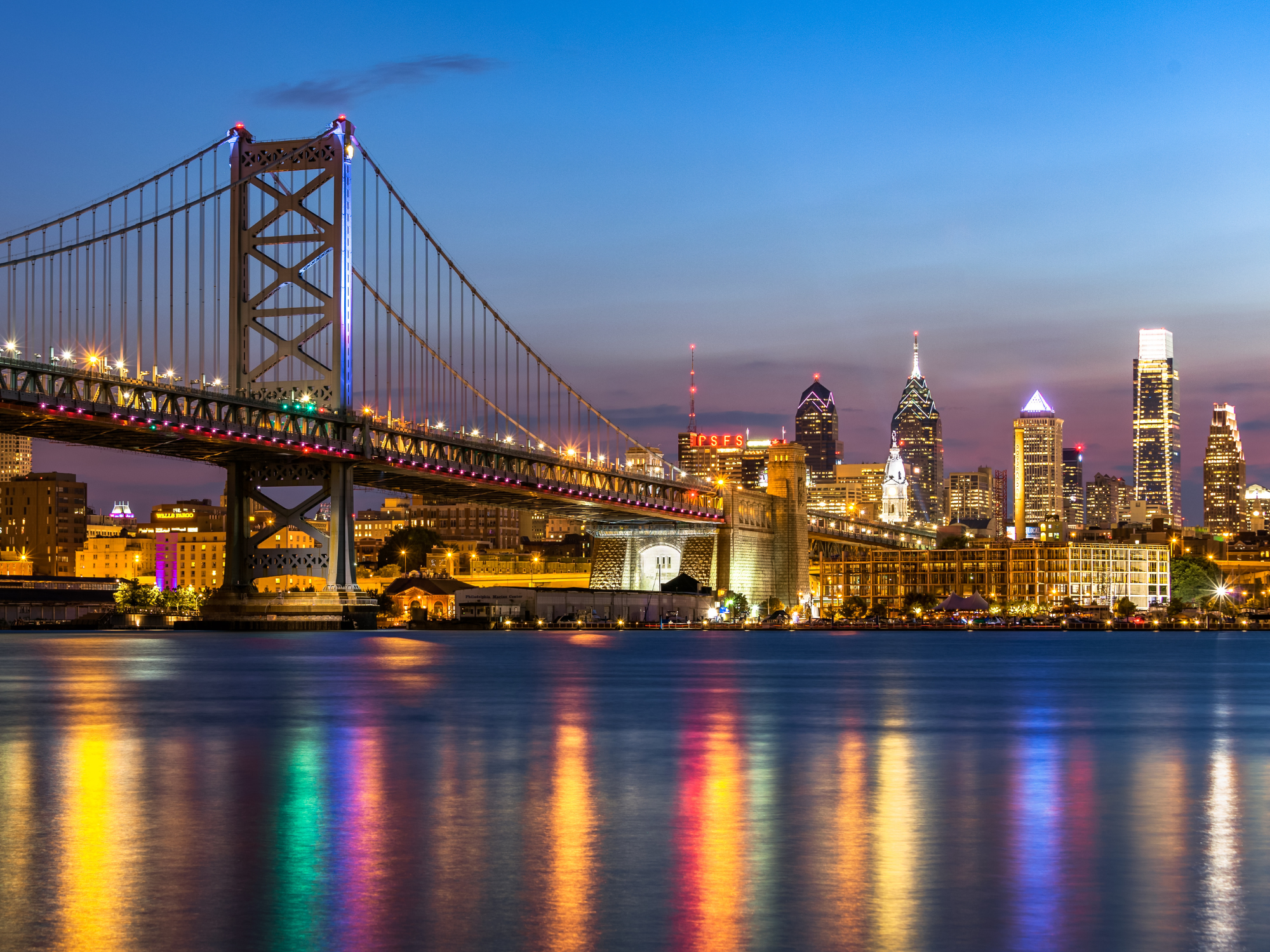 Philadelphia skyline and benjamin franklin bridge at night