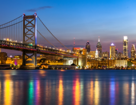 Philadelphia skyline and benjamin franklin bridge at night