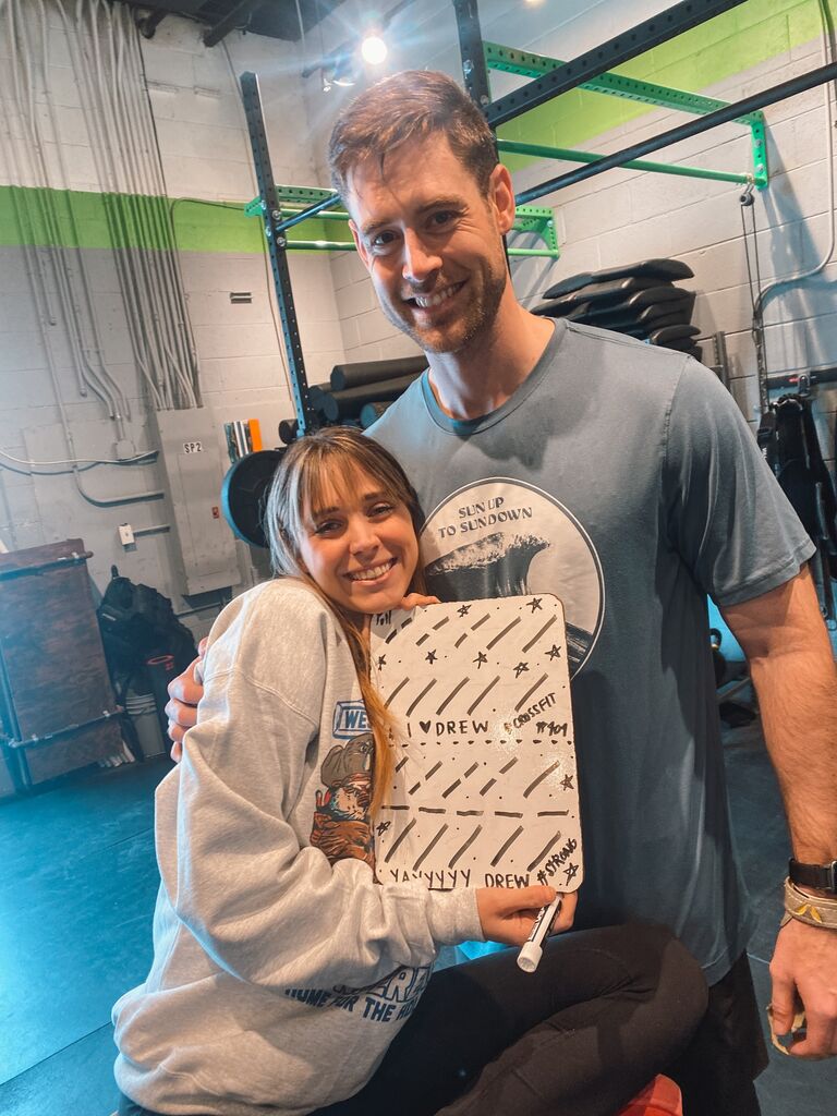 Allie continues her legacy of watching Drew do Crossfit. 