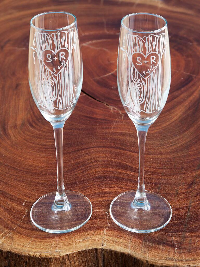 Champagne flutes with white 'bark' design and couple's initials inside heart