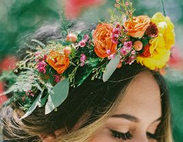 Bright bohemian flower crown with orange and yellow roses