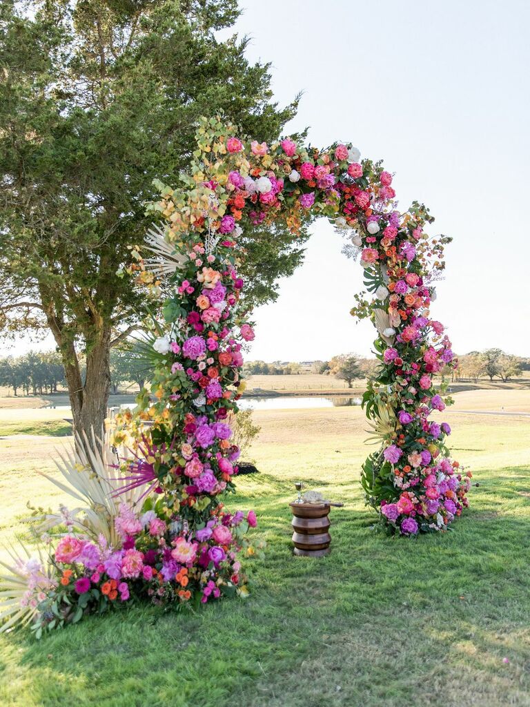 Floral arch covered in hot pink blooms