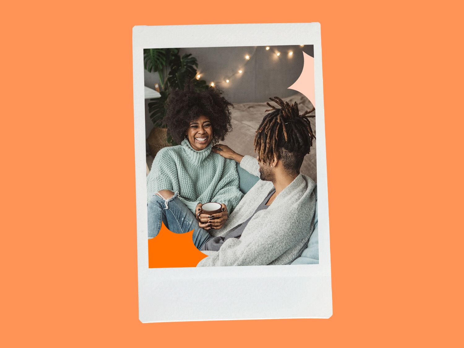 Couple smiling with eachother on a sofa