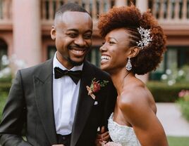 Bride and groom candid wedding portrait - bride in strapless wedding dress with embellished hair comb