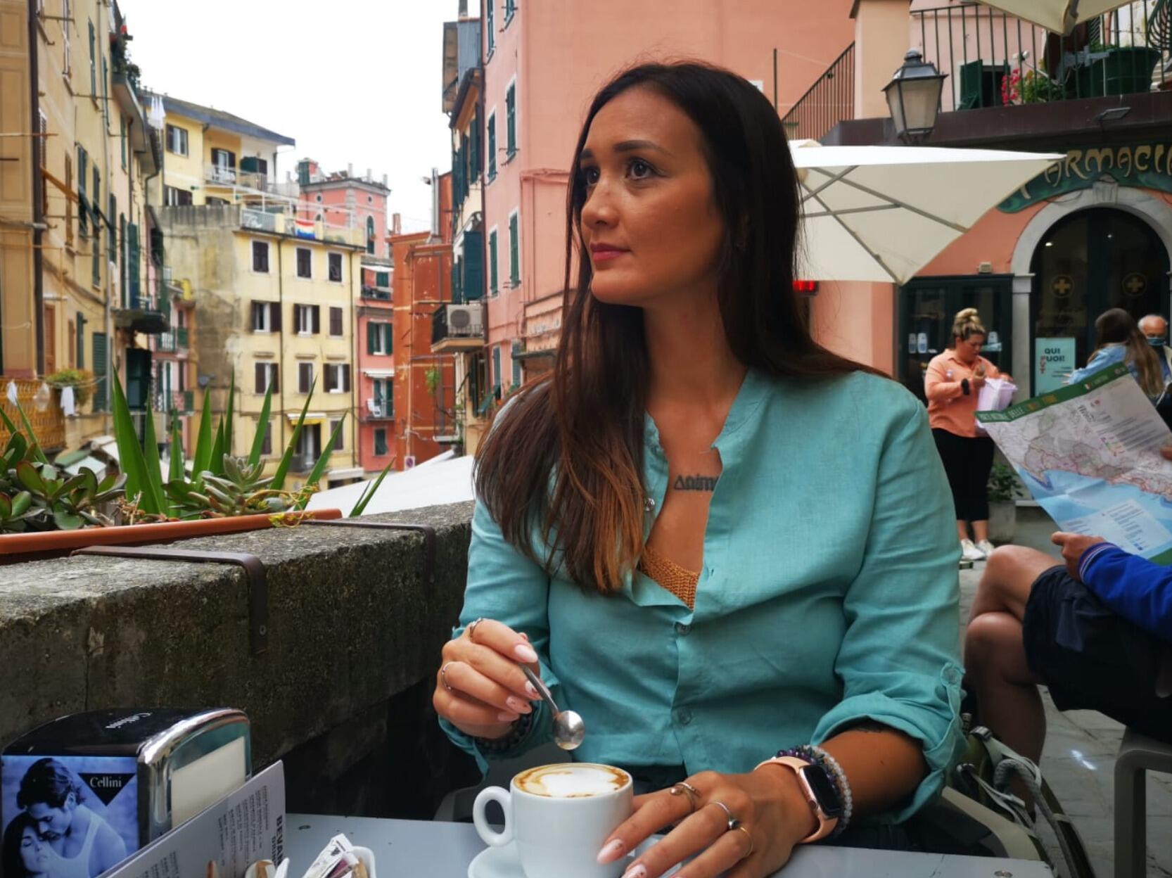 Kai enjoying her cafe in Cinque Terre, little did she know in a few hours Alessio would pull off the greatest surprise of her life!