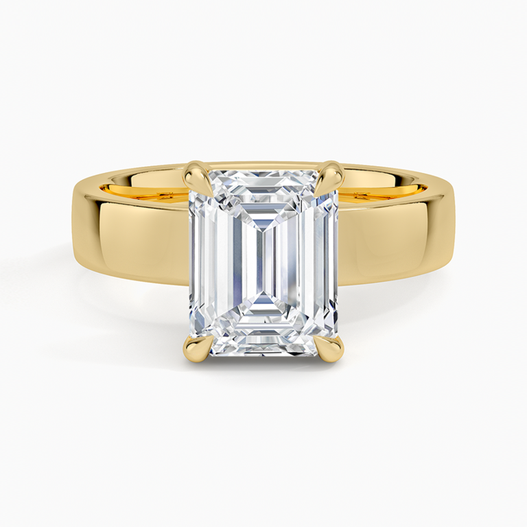 Emerald-cut engagement ring on thick gold band
