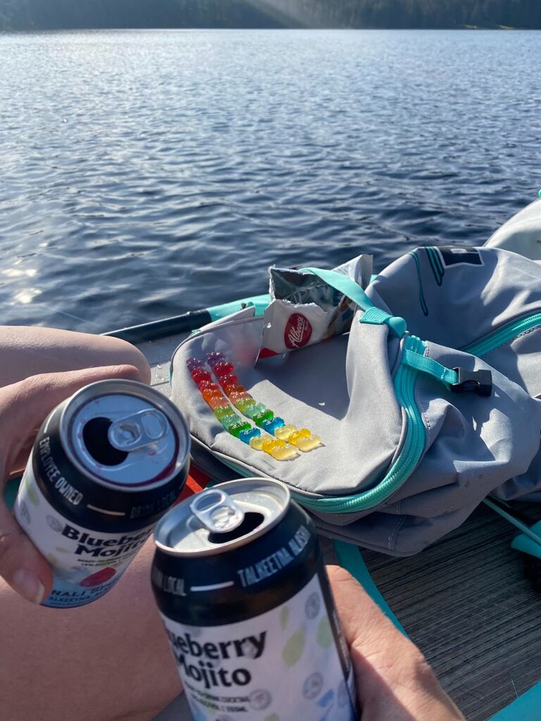 Taking advantage of the rare and elusive Juneau sunshine to paddleboard on the lake and do a gummie bear taste test.