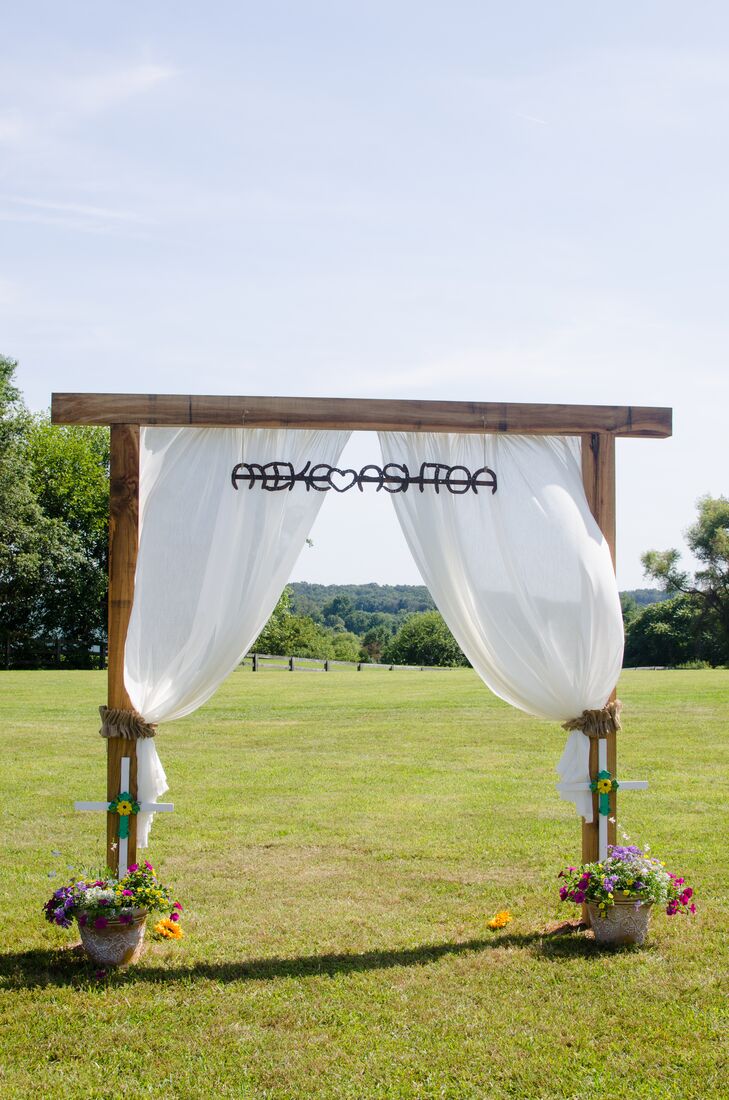 Wooden Wedding Arch With Billowing Drapes