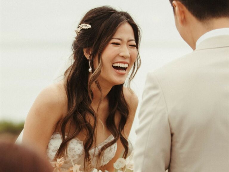 Bride wears a stylish barrette in her curled hair. 