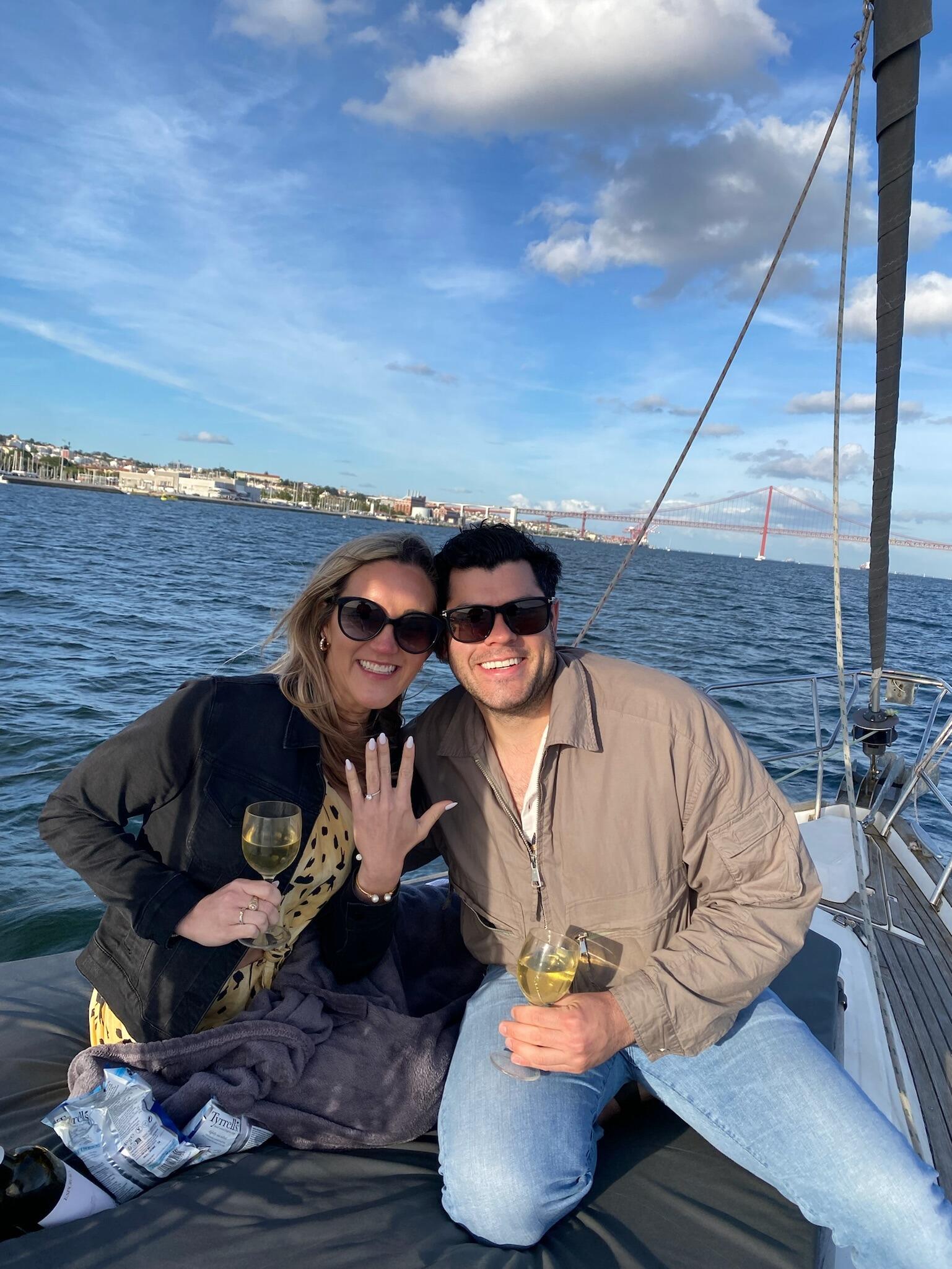 James proposed on a private sunset boat cruise on the Tagus River in Lisbon, Portugal!