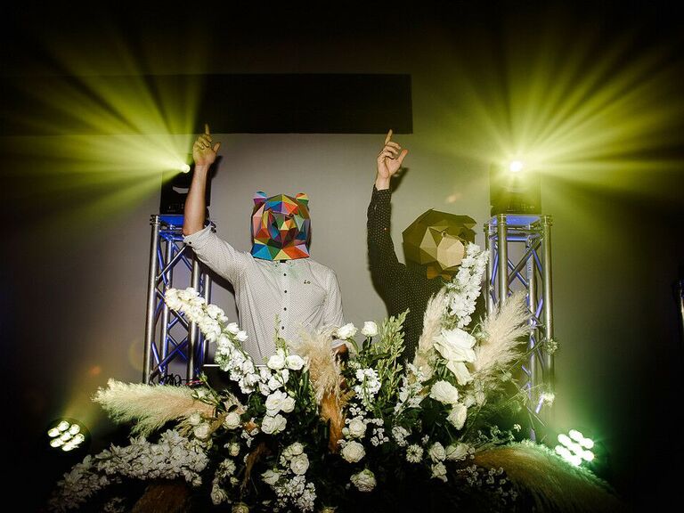 DJs wearing face masks at rave-inspired wedding reception