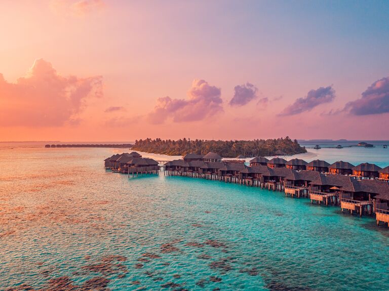 mythical honeymoons fading destinations climate change; location pictured the maldives overwater bungalows