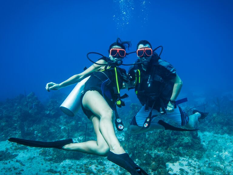 Couple doing scuba diving in Jamaica