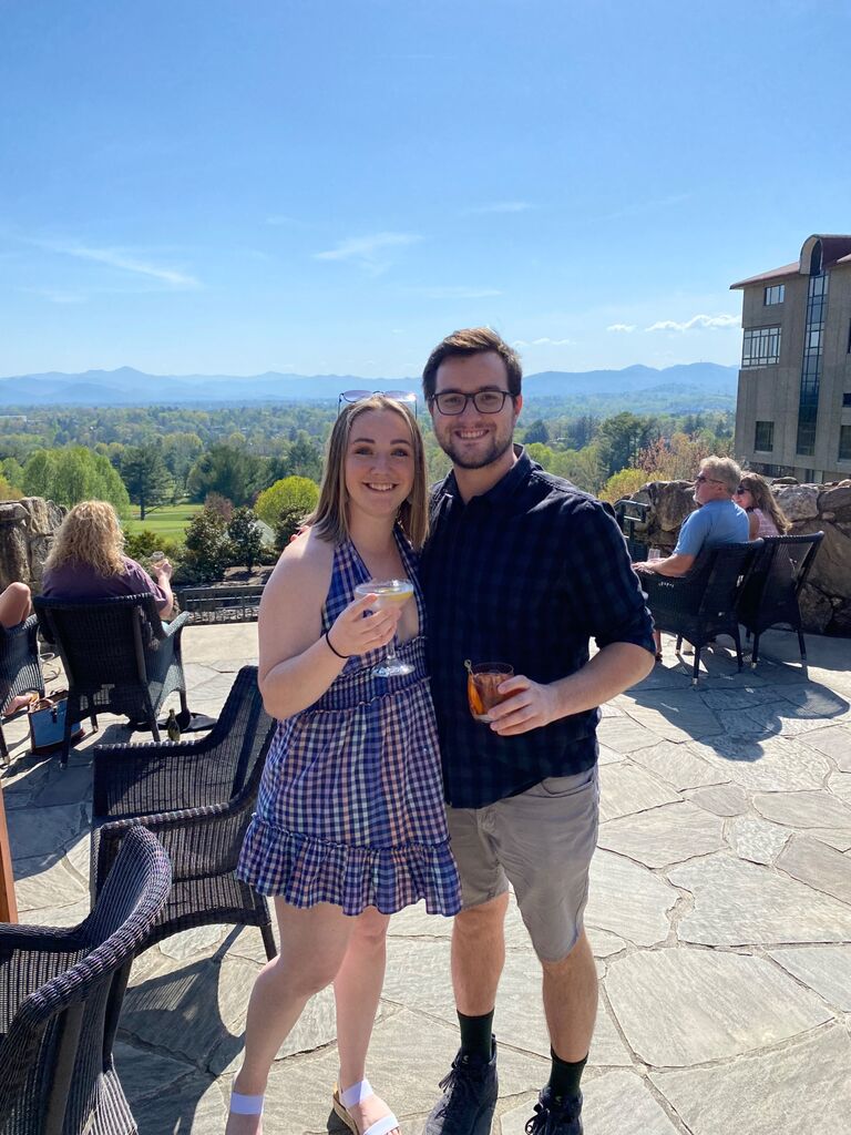 Josh and Sam took their very first vacation together in Asheville, NC. They hiked Mt. Mitchell, toured a number of breweries both independently and on an incredible brewery tour where they took this picture getting cocktails at the Omni Grove Park Inn. This is where both Josh and Sam "fell in love" with one another, but it would take a bit longer to say it out loud. They both still cherish these memories together and this vacation is a large reason why the wedding is in Asheville!