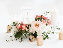 Wine cork table numbers with light pink and white flowers