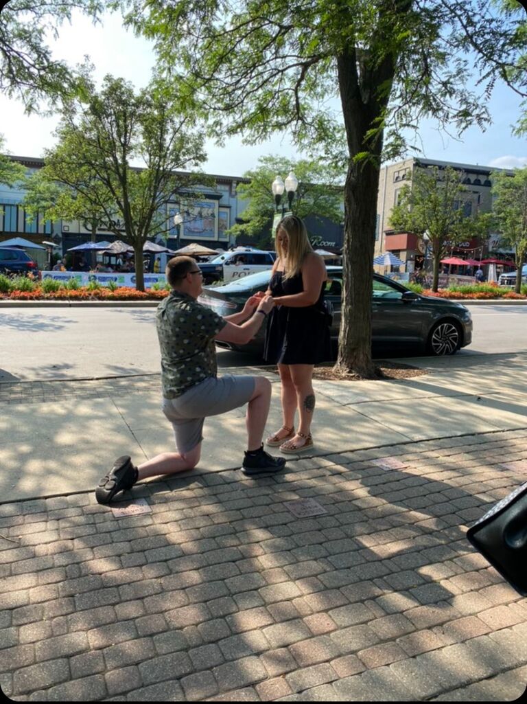 FINALLY, on their 4 year dating anniversary Thomas proposed Downtown Plymouth, MI. 