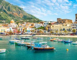 ischia italy village and castle in backdrop gorgeous photo of boats and the island's architectural appeal