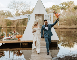 Bride and groom walking on dock at Enchanted Oaks Farm & Lakehouse affordable wedding venue in Ocala, Florida